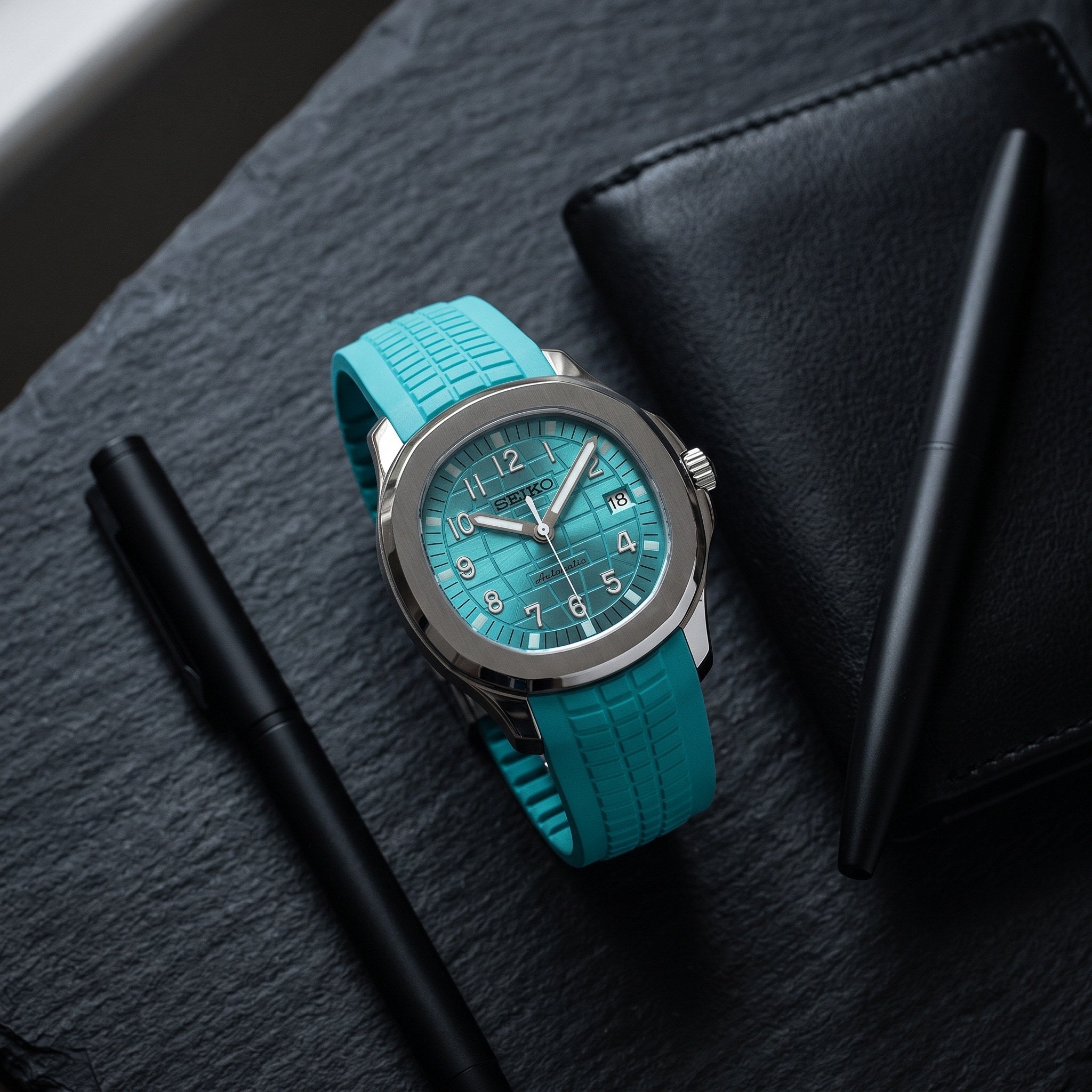 Aqua Mod – Teal Dial – 41mm – Automatic – lifestyle flat lay