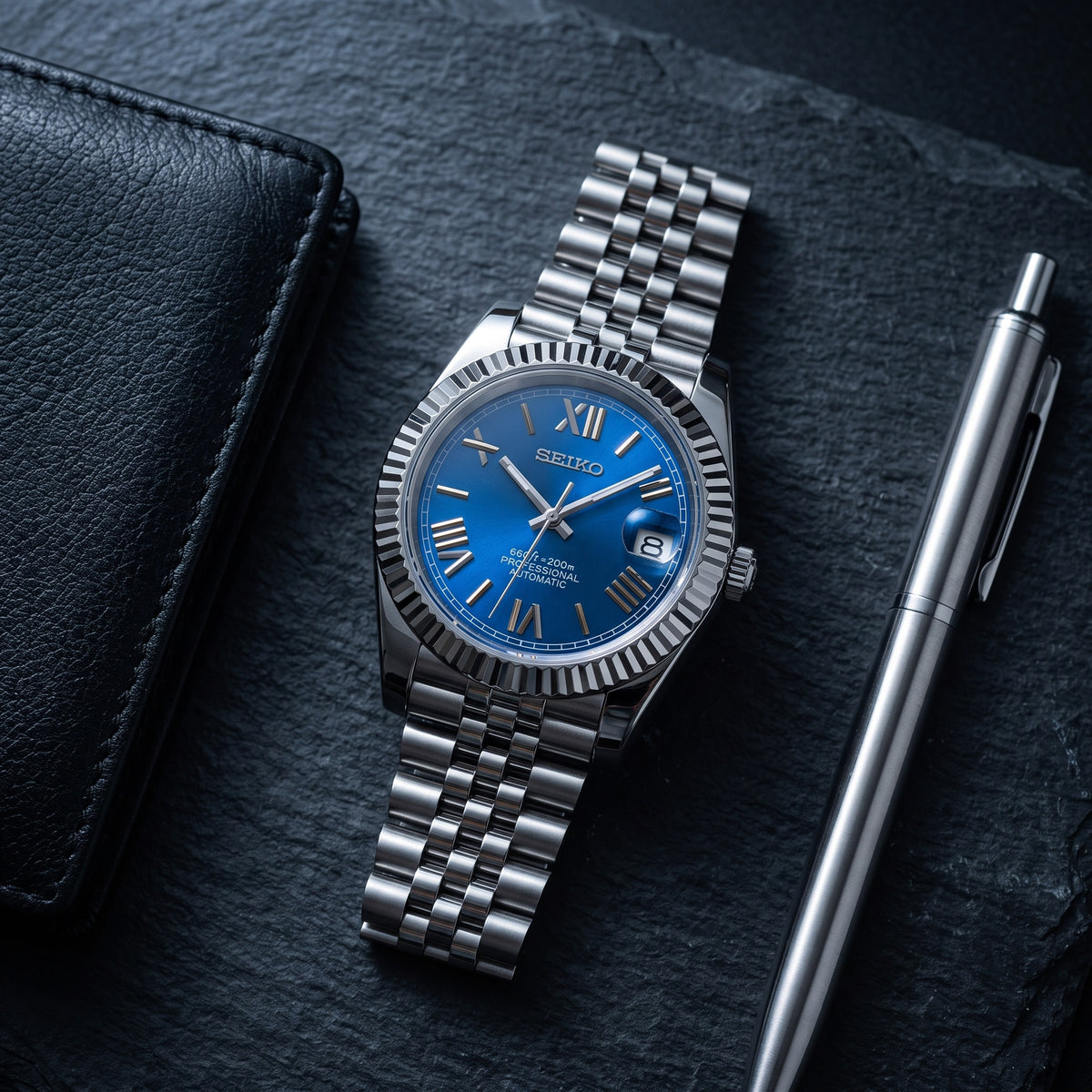 Date Mod – Steel · Blue Roman Dial II – Automatic – lifestyle flat lay