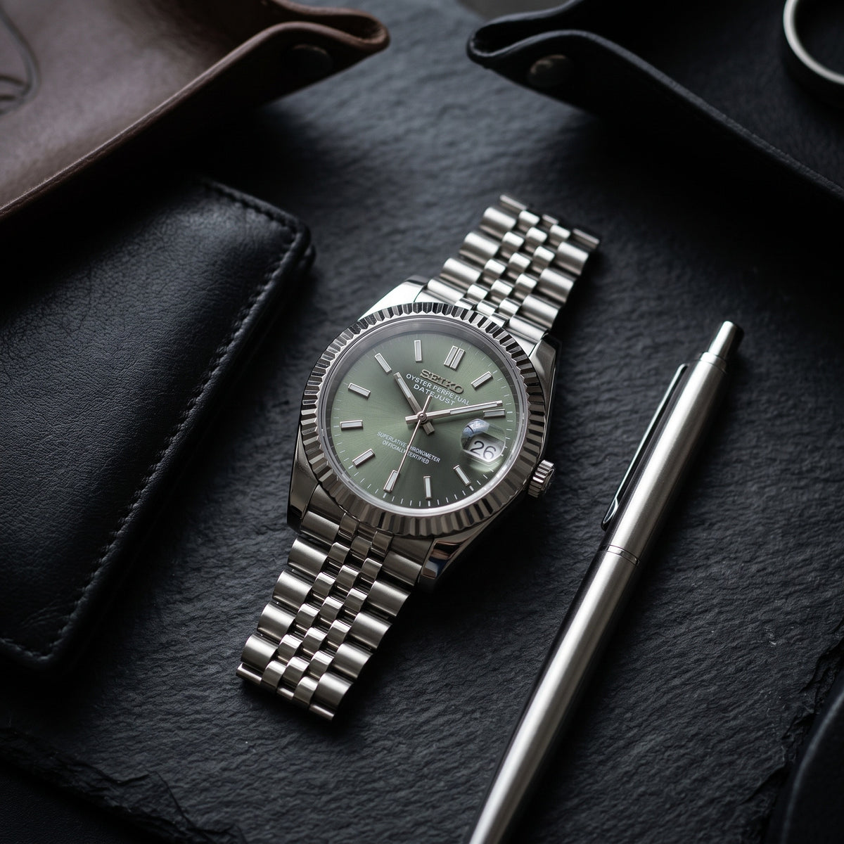 Date Mod – Steel · Green Sunburst Dial – Automatic – lifestyle flat lay