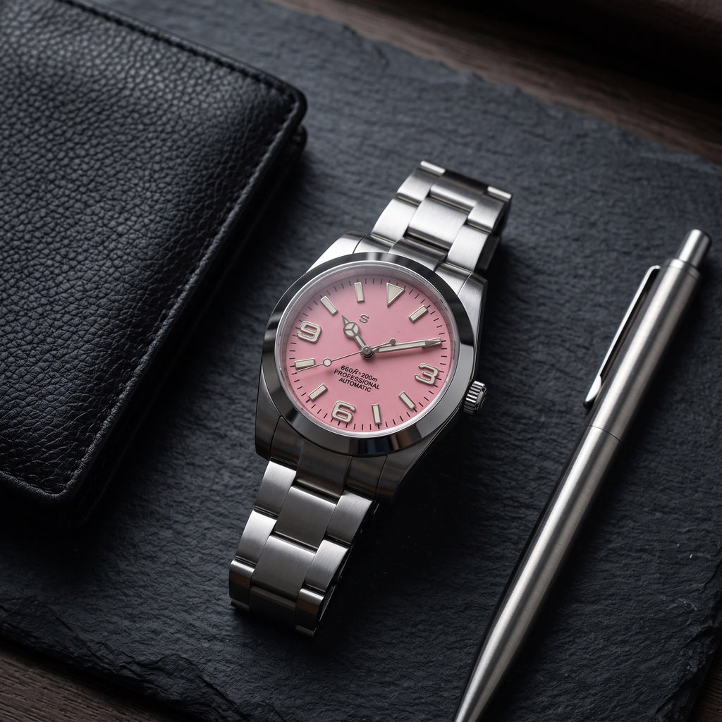 Date Mod – Steel · Pink Dial · Smooth Bezel – Automatic – lifestyle flat lay