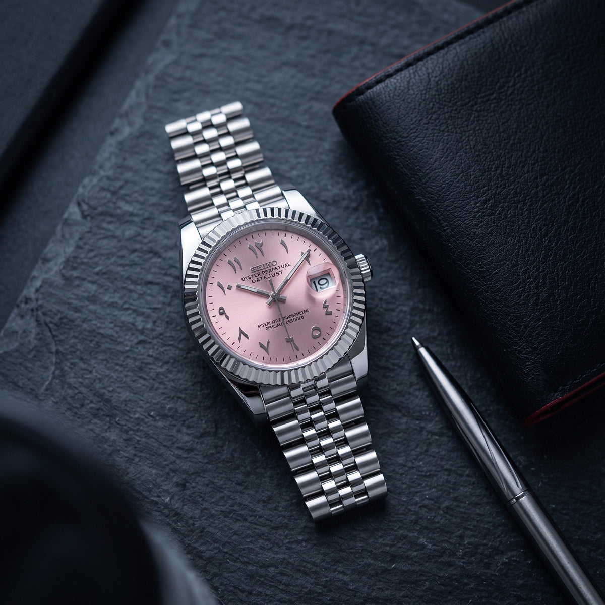 Date Mod – Steel · Pink Stick Dial – Automatic – lifestyle flat lay