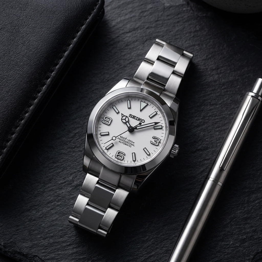 Date Mod – Steel · Silver Explorer Dial – Automatic – lifestyle flat lay