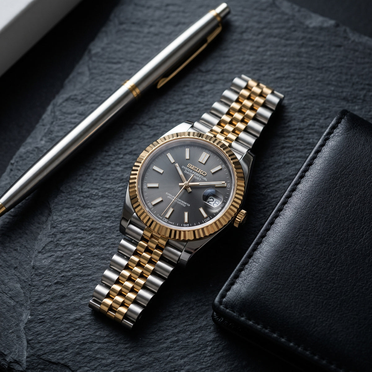 Date Mod – Two-Tone Gold · Grey Stick Dial – Automatic – lifestyle flat lay