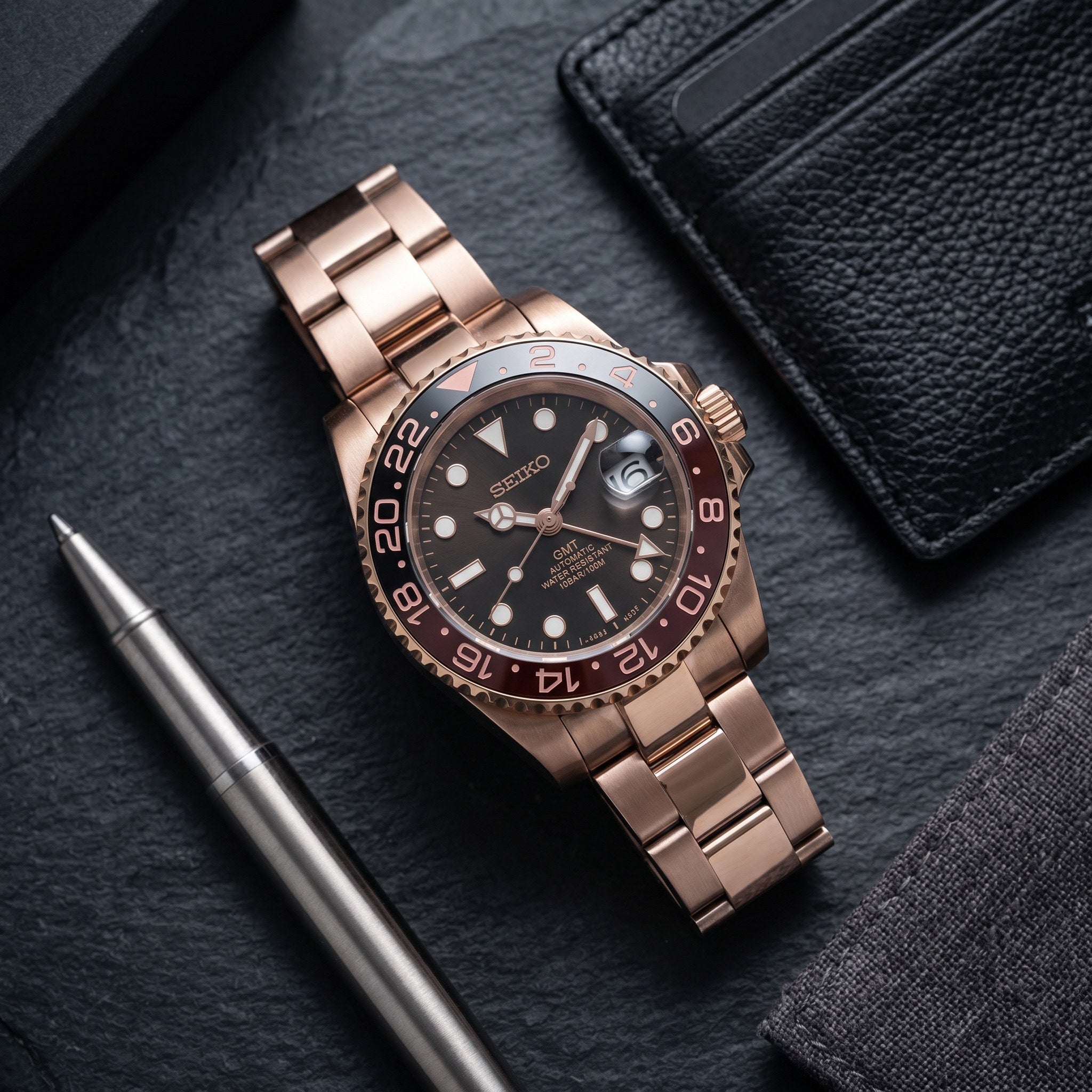 GMT Mod – Rose Gold · Root Beer Bezel – 40mm – Automatic GMT – lifestyle flat lay