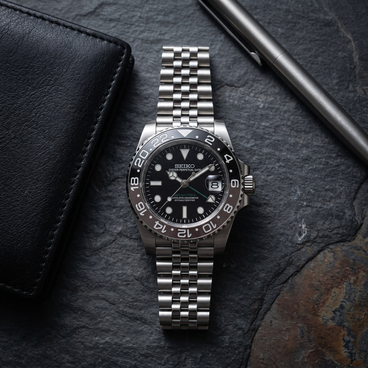 GMT Mod – Steel · Black Ceramic Bezel – 40mm – Automatic GMT – lifestyle flat lay