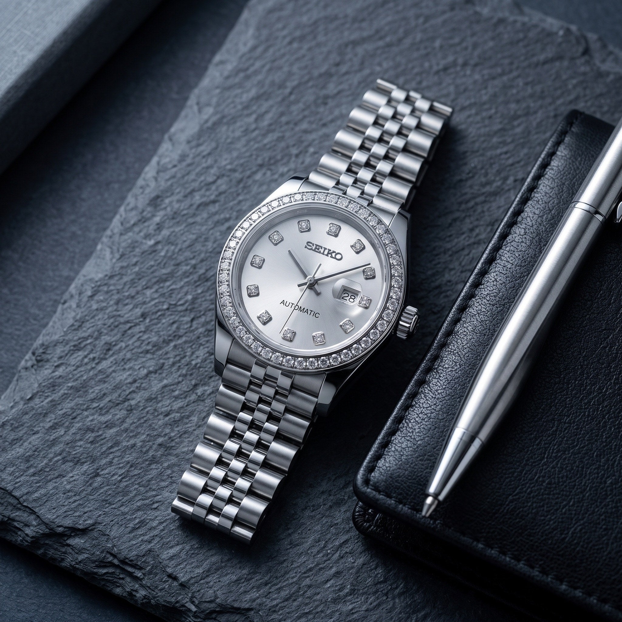 Lady Mod – Steel · Diamond Bezel · Silver Dial – 28mm – Automatic – lifestyle flat lay