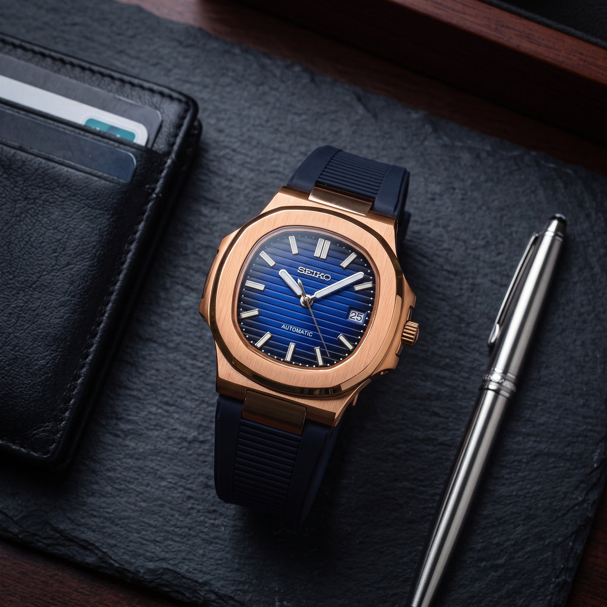 Naut Mod – Rose Gold · Blue Dial · Rubber – 41mm – Automatic – lifestyle flat lay