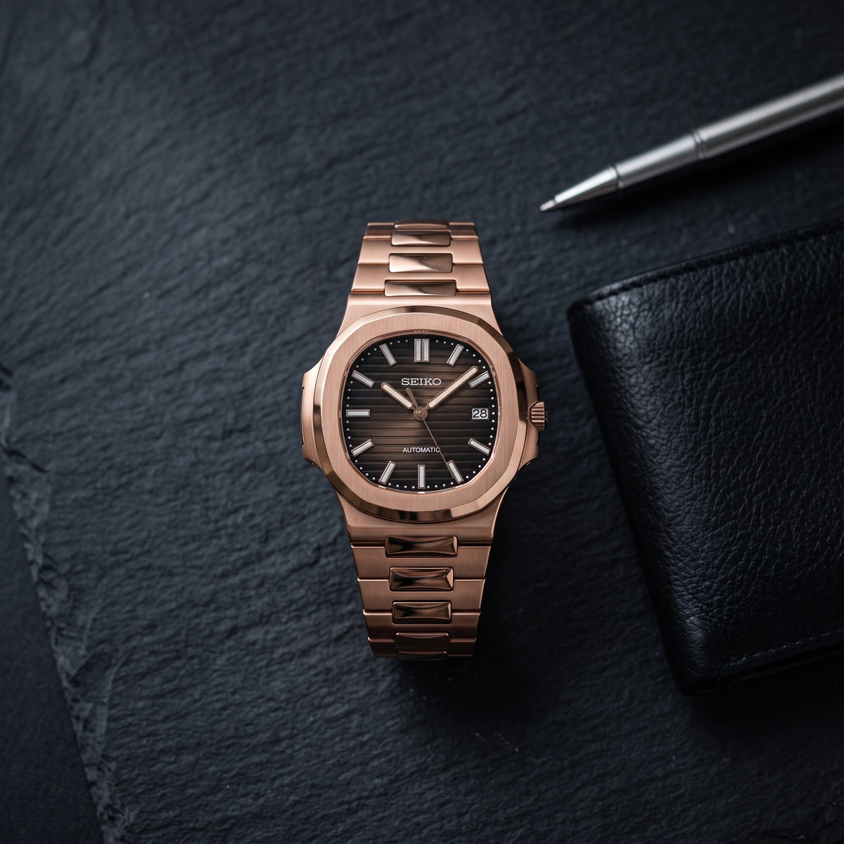 Naut Mod – Rose Gold · Brown Dial – 41mm – Automatic – lifestyle flat lay