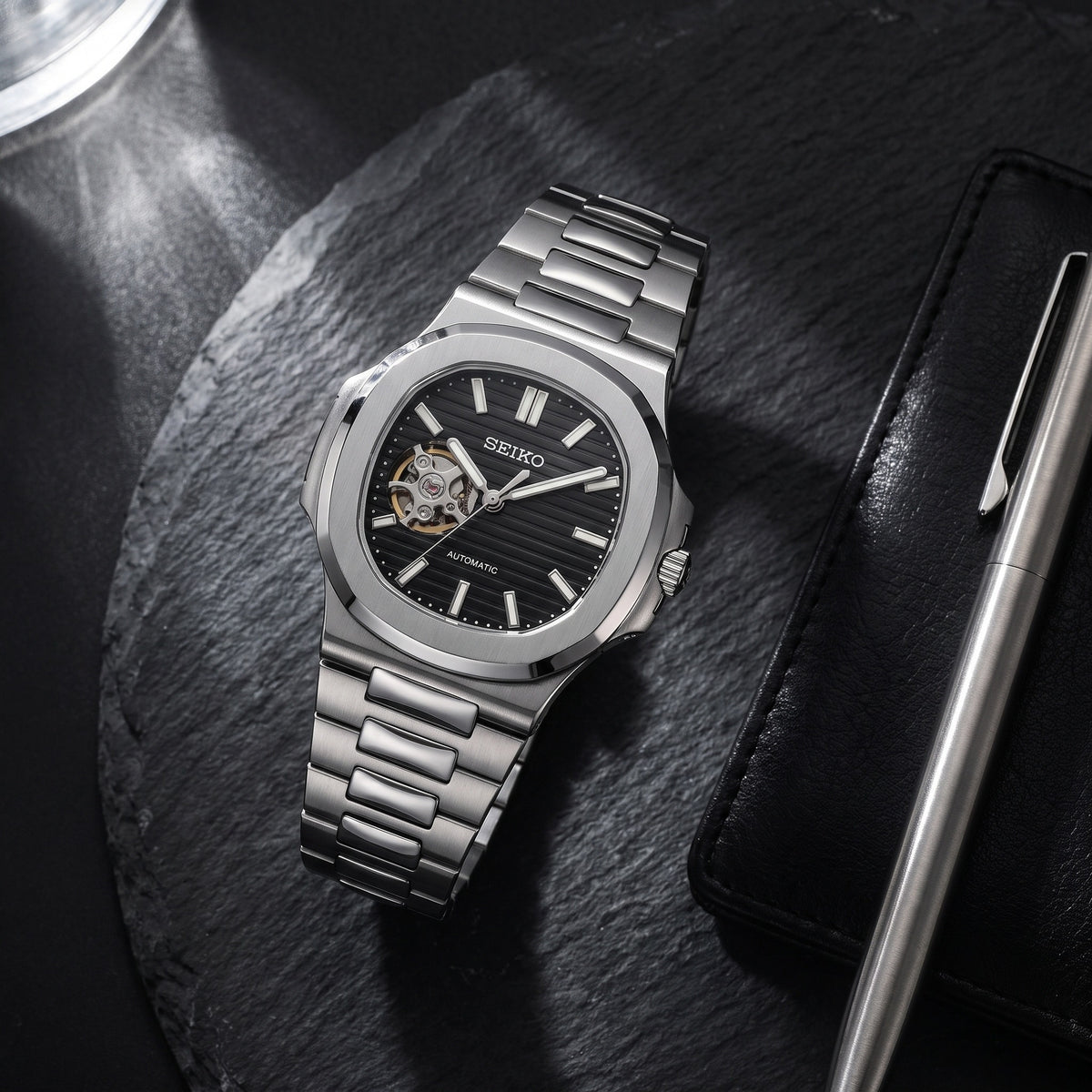Naut Mod – Steel · Black Open-Heart Dial – 41mm – Automatic – lifestyle flat lay