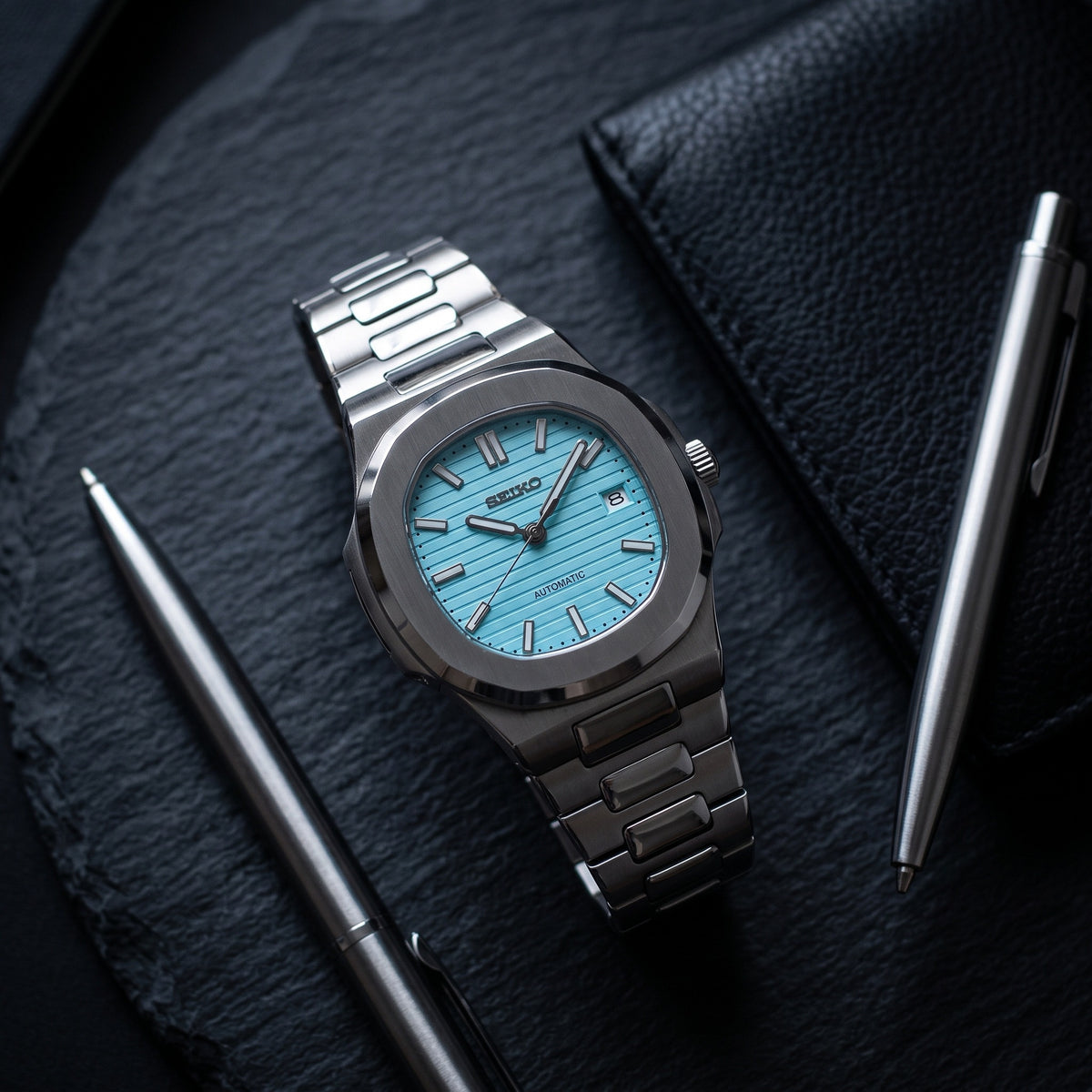 Naut Mod – Steel · Ice-Blue Dial – 41mm – Automatic – lifestyle flat lay