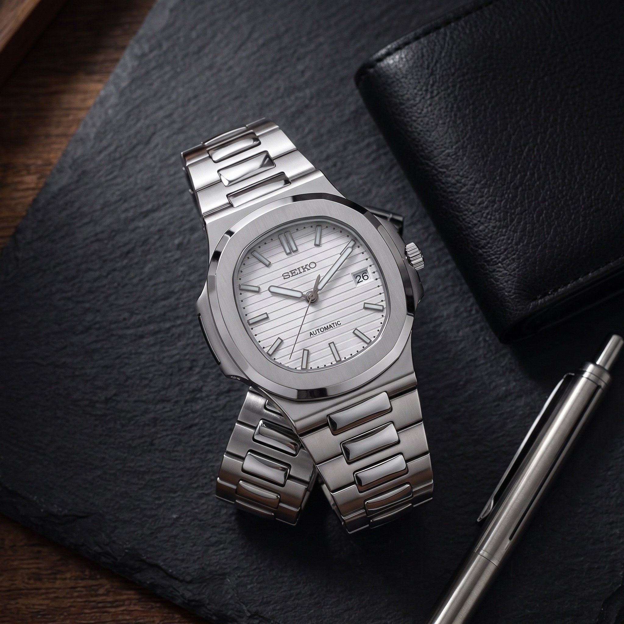 Naut Mod – Steel · White Dial – 41mm – Automatic – lifestyle flat lay