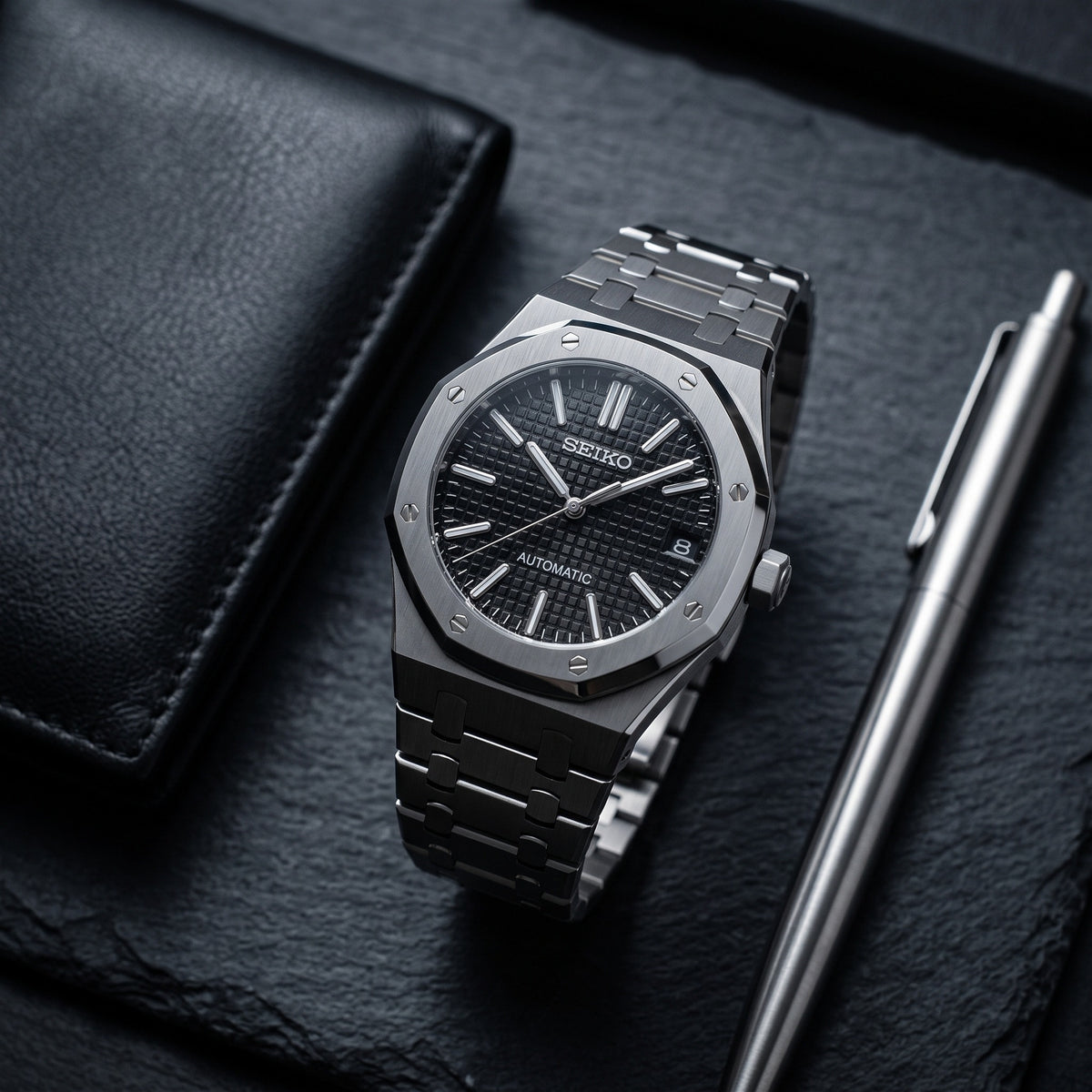 Oak Mod – Steel · Black Tapisserie Dial II – 41mm – Automatic – lifestyle flat lay