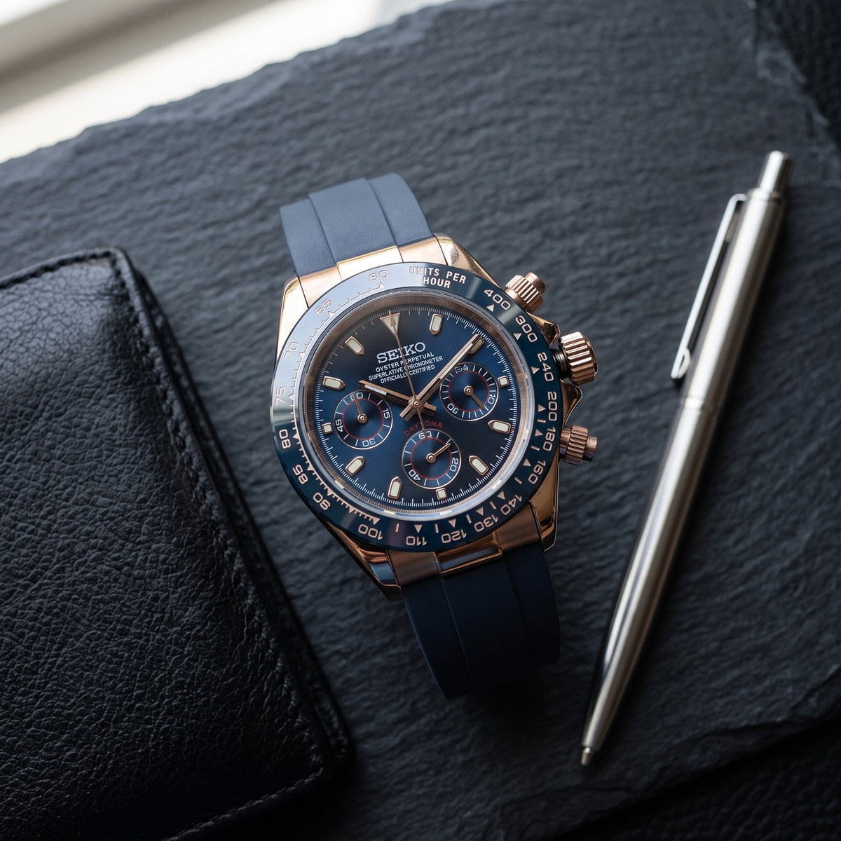 Tona Mod – Rose Gold · Blue Dial · Rubber – 40mm – Chronograph – lifestyle flat lay
