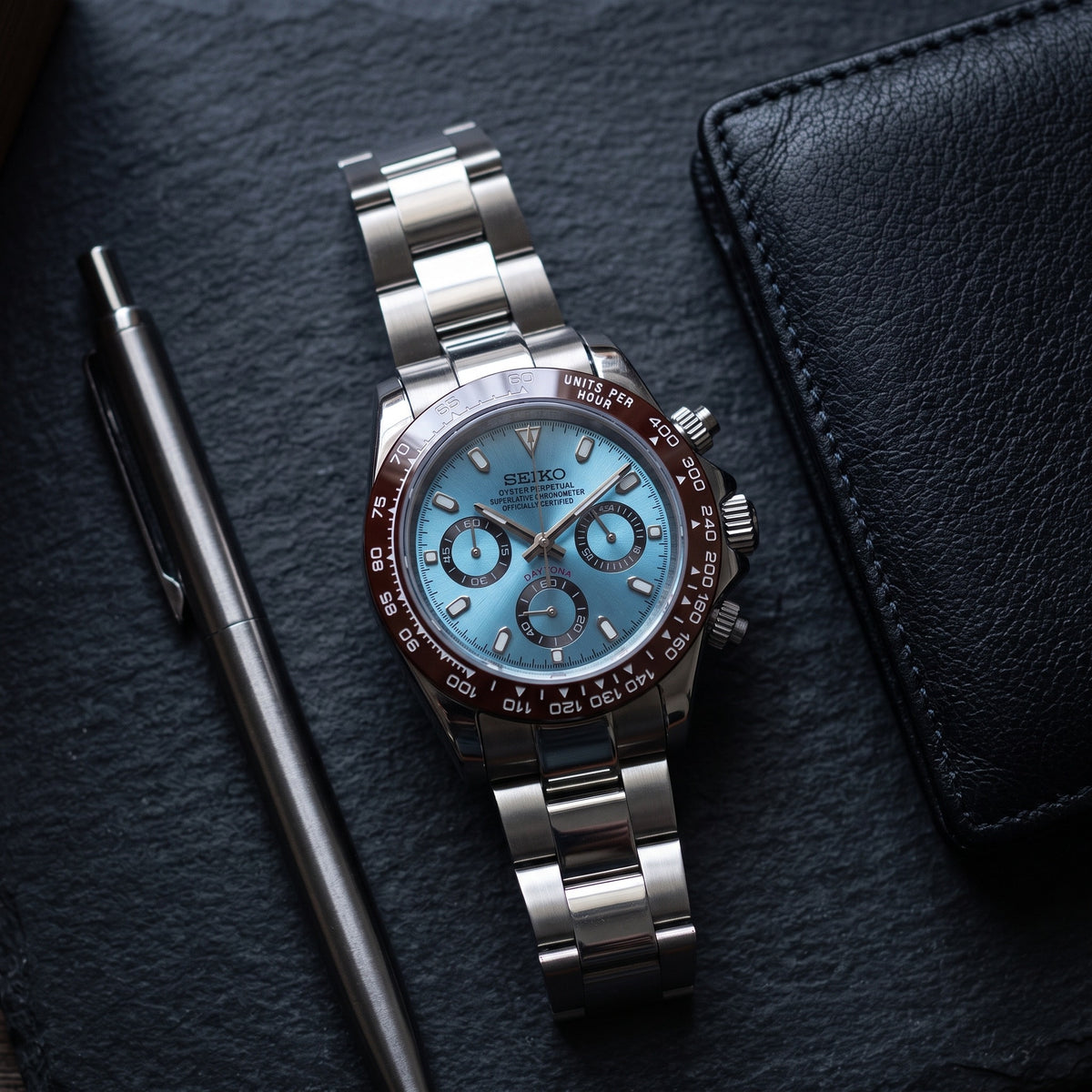 Tona Mod – Steel · Ice-Blue Brown-Bezel Dial – 40mm – Chronograph – lifestyle flat lay